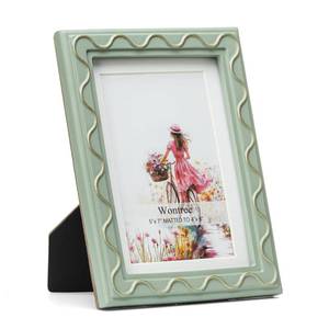 lot 6120 image: Wontree 5x7 Picture Frame, Shinning Gold Swirls Against Sage-like Green, Resin Frame with Real Glass, Display 5x7 Photos Matted to 4x6, Vertical and Horizontal Desk Tabletop or Wall Hanging