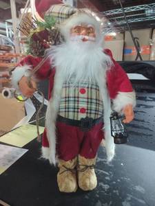 lot 7512 image: Plaid Vest Santa Claus Figure with Lantern