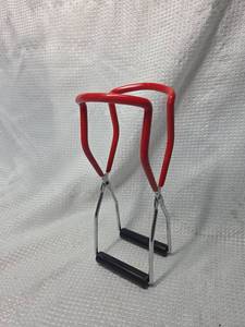 lot 32 image: Red Handle Canning Jar Lifter Tongs