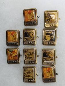 lot 197 image: Antique TV Show Miniature Television Charm Set
