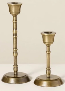 lot 42737 image: Magnolia Taper Marble and Brass Candleholder, Taper candles and a set of glass holders.
