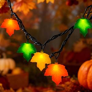 lot 15638 image: Thanksgiving Day Tricolor Maple Leaf String Light with 10 LED Bulbs, 8.5Ft Plug in Multi-Color Fall Lights for Autumn Thanksgiving Day Halloween Christmas Home Decor, Black Wire - Retail $18