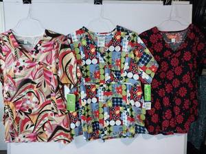 lot 67908 image: APPEARS NEW - Landau, Orange & Bio Brand Medical Scrub Tops (Size XL) 3 Pack