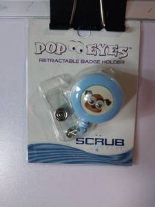 lot 67951 image: APPEARS NEW - Pop Eyes Scrub Retractable Badge Holder with a Dog