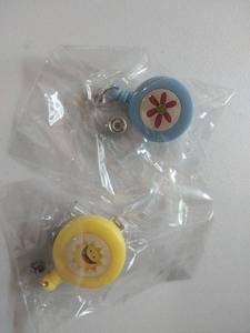 lot 68076 image: FACTORY SEALED - Decorative Badge Reel Set - Sun and Flower Design