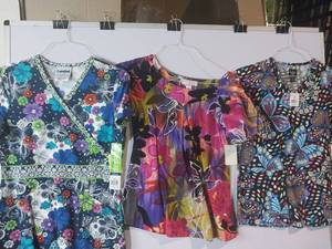 lot 68167 image: APPEARS NEW - Landau, Koi & Med Couture Medical Scrub Tops (Size XS) Lot of 3