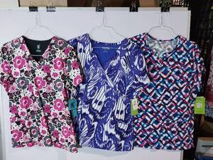 lot 68203 image: APPEARS NEW - Landau, MC2 & Bio Patterned Medical Scrub Tops Set (Size Large) 3 Pack