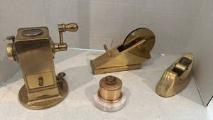 lot 1240 image: Vintage brass pencil sharpener, tape dispensers and stamp postage holder