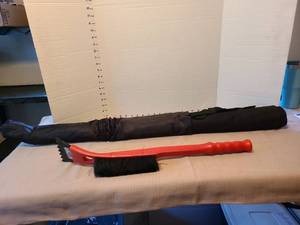 lot 7001 image: Windshield cover in bag and ice scraper with brush.