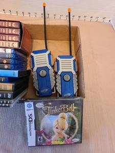 lot 7021 image: DVDs, including Indiana Jones series, plastic walkie-talkies, Nintendo Tinkerbell