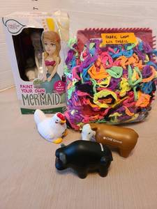 lot 7026 image: Fabric loom and fabric, paint your own mermaid toy, spongy farm animals.