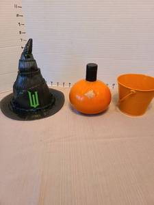 lot 7036 image: Orange pumpkin shape liquor bottle, witch hat sipper cup, tin bucket