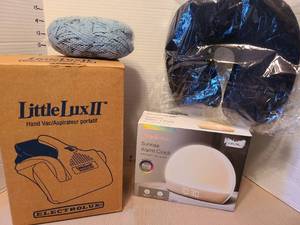 lot 7046 image: Electrolux Little Lux II hand vac, Brookstone sunrise alarm clock, more.