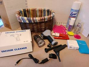 lot 7058 image: Mini hand vacuum, lined basket, toiletries