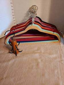 lot 7143 image: 20 flocked hangers and a belt hanger