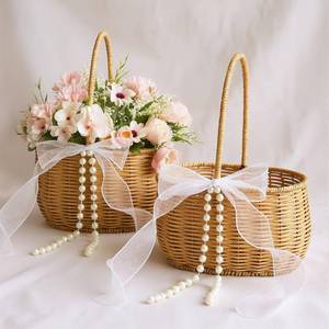 lot 5151 image: 2 Pcs Wicker Rattan Flower Girl Basket with Bows and Pearl 11.8x8.7x5.1 Inches Rustic Wedding Basket for Flower Girl, Hand Woven Willow Storage for Ceremonies Home Decoration (Classic)
