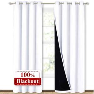 lot 59067 image: NICETOWN 100% Blackout Window Curtain Panels, Cold and Full Light Blocking Drapes with Black Liner for Nursery, 84 inches Drop Thermal Insulated Draperies (White, 2 Pieces, 52 Wide Each Panel) - Retail $27