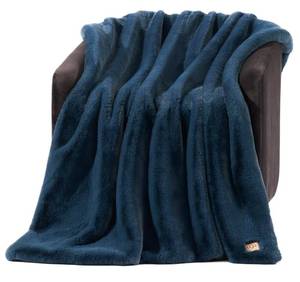 lot 25917 image: UGG Euphoria Faux Fur Throw Blanket, Soft Warm Throw Blankets for Couch or Bed, Luxury Bedroom Decor, Giftable Fuzzy Blankets, Machine Washable, 50-inch x 70-inch, Indigo Blue - Retail $93