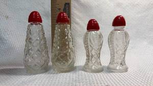lot 44 image: Crystal Pattern Glass Salt and Pepper Shakers with Red Caps