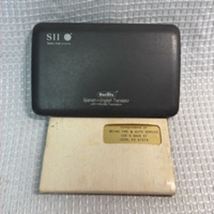 lot 150 image: Berlitz SII Spanish-English Electronic Translator & Promotional Calculator