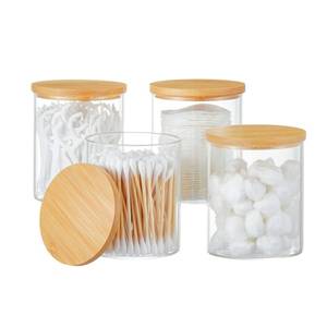 lot 25455 image: 4 Pack Glass Qtip Holder Dispenser Glass Apothecary Jars with Lids Cotton Ball Swab Pad Holder Bathroom Essential Canisters Accessories Jars for Bathroom Organization Vanity Organizers - Retail $24