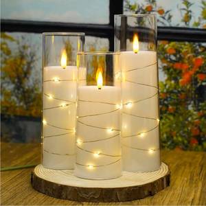 lot 69518 image: Flameless LED Glass Pillar Candles with String Lights - Retail $35