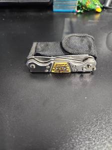 lot 3824 image: USA Super Knife with Yellow Tiger Pattern Handle