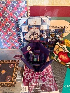 lot 121 image: Quilting Journals, Photo Albums, Pattern Books and a Pin CushionStorage