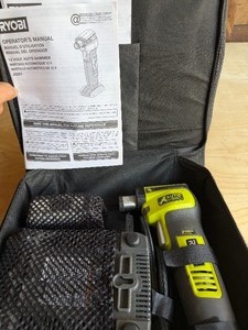 lot 54 image: Ryobi Auto Hammer in Case w Battery and Charger (case is torn - please see pictures)