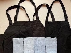 lot 399 image: Black Aprons (4) and Washcloths