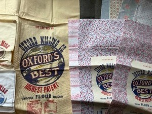 lot 432 image: Flour Sacks, All Like New Conditions, One Needs Stitched