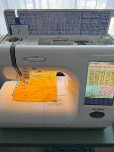 lot 447 image: Janome Sewing and Embroidery Memory Craft 10000 and All Accessories From the Table