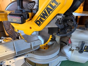 lot 58 image: DeWalt Double Bevel Sliding Compound Miter Saw Mounted on Craftsman Base