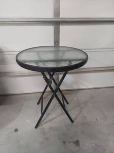 lot 1189 image: Round Glass Top Patio Table with Folding Base