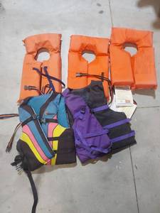 lot 1313 image: Life Jacket Lot with Orange Type II PFDs and Various Vests