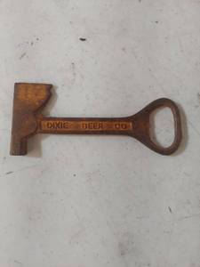 lot 1406 image: Dixie Beer Company Cast Iron Bottle Opener