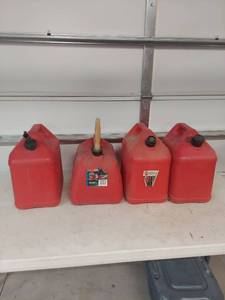 lot 1784 image: Set of 4 Red Plastic Gas Cans with Spouts 5 gal