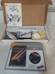 lot 2118 image: Music Learning Bundle with Books, Stand, and Accessories