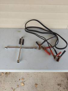 lot 1021 image: 4-Way Lug Wrench and Jumper Cable Set