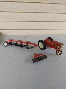 lot 1024 image: Farmall 404 Toy Tractor with Disc Plow and Harrow Implements