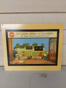 lot 1130 image: Remington UMC .22 Caliber Rifles and Cartridges Tin Sign