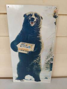 lot 1133 image: US Cartridges Black Shells Bear Advertising Tin Sign