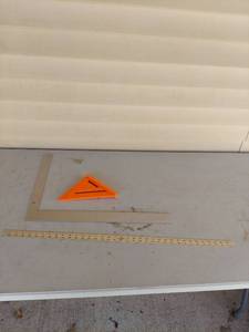 lot 1243 image: Carpenters Tool Set - Rafter Square, Framing Square & Yardstick
