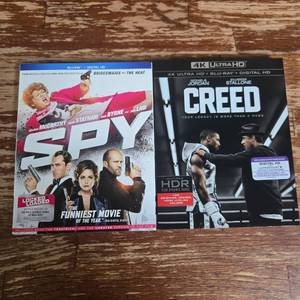 lot 89 image: Spy (2015) & Creed (2015) 4K UHD  Blu-ray Movie Bundle