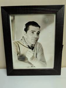 lot 16879 image: Clark Gable - 1950s Hollywood Studio Metro Goldwyn - Mayer in Dark Wood Frame