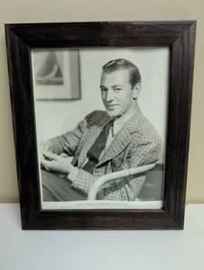 lot 16881 image: 1935 Gary Cooper Paramount Pictures Studio Photo in dark wood frame