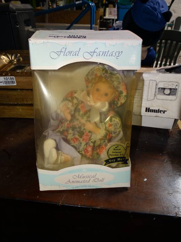 lot 10190 image: Floral Fantasy Genuine Porcelain Musical Animated Doll