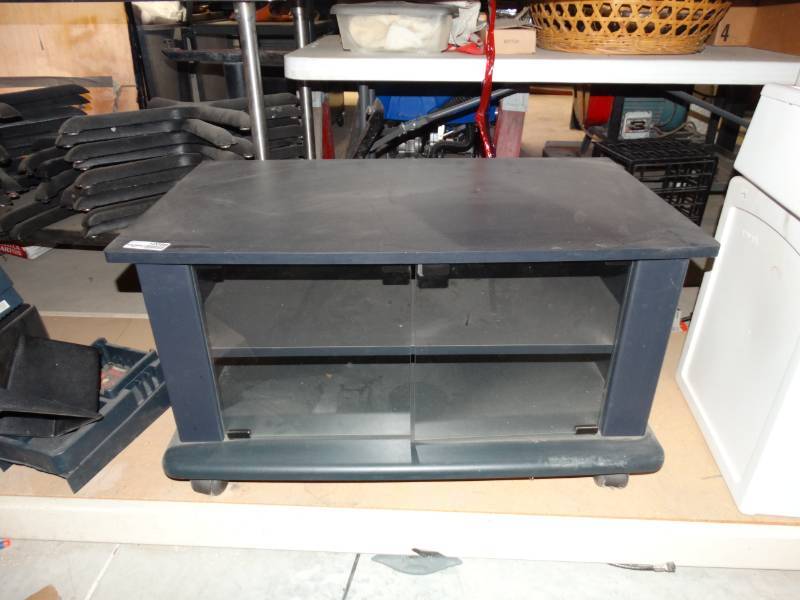 lot 10398 image: small tv stand with glass doors
