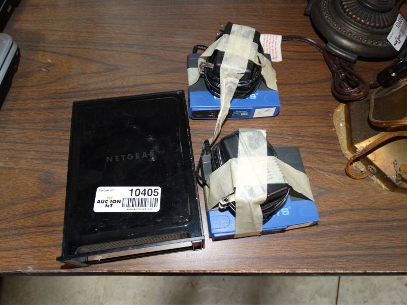 lot 10405 image: two linksys modems and one net gear router