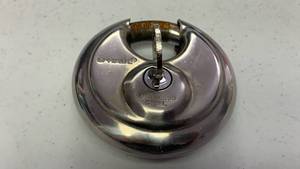 lot 400 image: U-Haul Stainless Steel Round Disc Lock key included